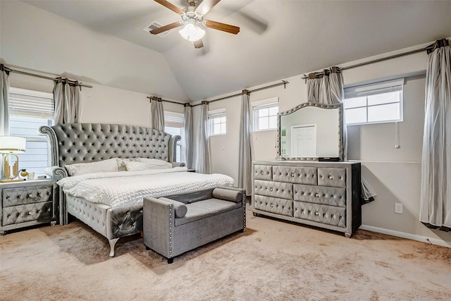 carpeted bedroom featuring vaulted ceiling and ceiling fan