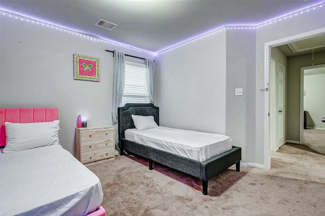 bedroom with light colored carpet