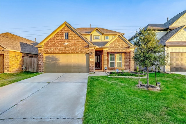 view of front of home with a garage and a front lawn