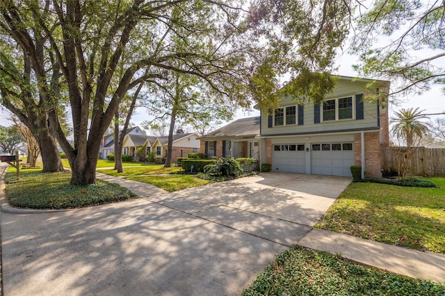 view of front of property with a garage and a front yard