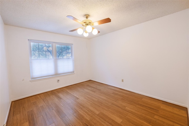 unfurnished room with hardwood / wood-style floors, a textured ceiling, and ceiling fan