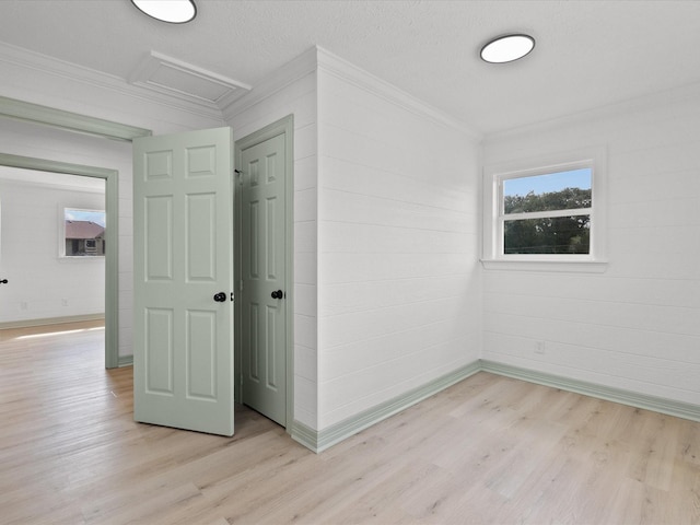 106 Palm Dr Unit Cr776, Liverpool, TX 77577 - unfurnished bedroom featuring attic access, light wood-style floors, baseboards, and ornamental molding