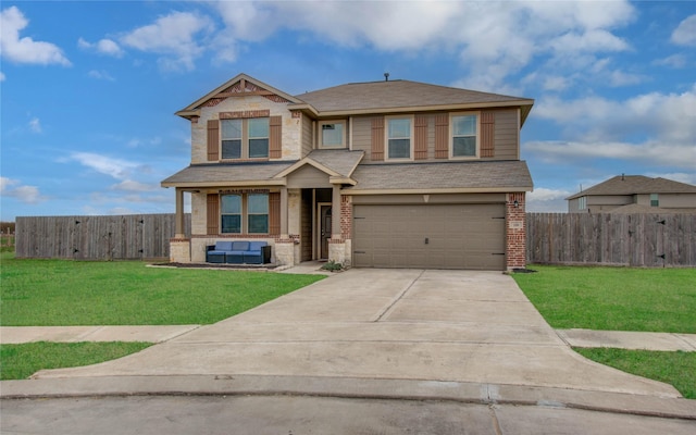 craftsman house with a garage and a front lawn