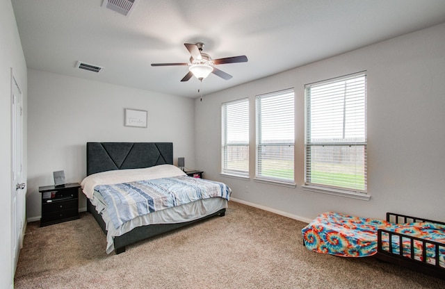 bedroom with ceiling fan and carpet flooring