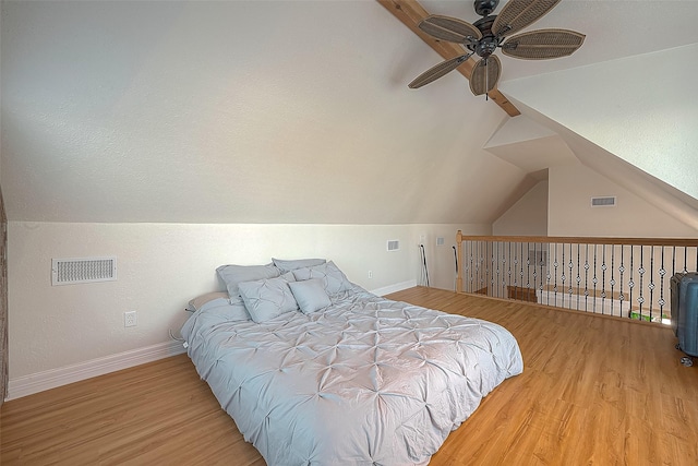 3520 Ave S Unit 1/2, Galveston, TX 77550 - bedroom with ceiling fan, vaulted ceiling, and light wood-type flooring