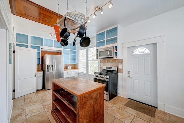 3520 Ave S Unit 1/2, Galveston, TX 77550 - kitchen with tasteful backsplash, appliances with stainless steel finishes, and a notable chandelier