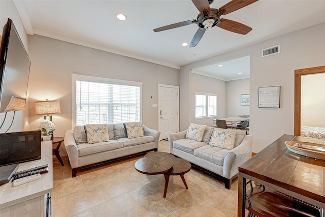 3520 Ave S Unit 1/2, Galveston, TX 77550 - tiled living room featuring crown molding and ceiling fan