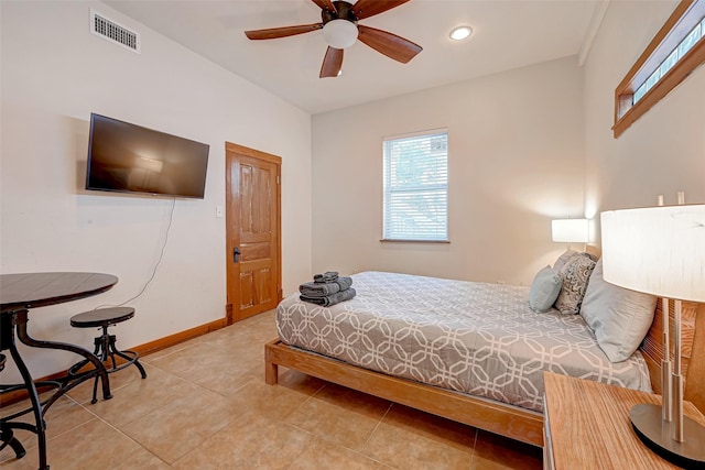 3520 Ave S Unit 1/2, Galveston, TX 77550 - tiled bedroom featuring ceiling fan