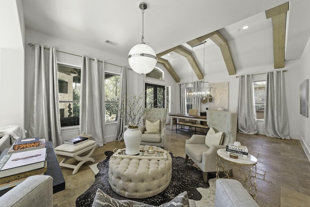 sitting room featuring a wealth of natural light, visible vents, stone tile floors, and vaulted ceiling with beams