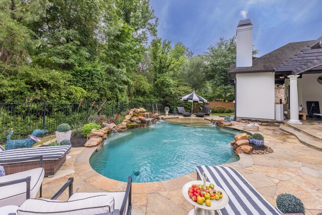 view of swimming pool with a patio area, a fenced backyard, and a fenced in pool