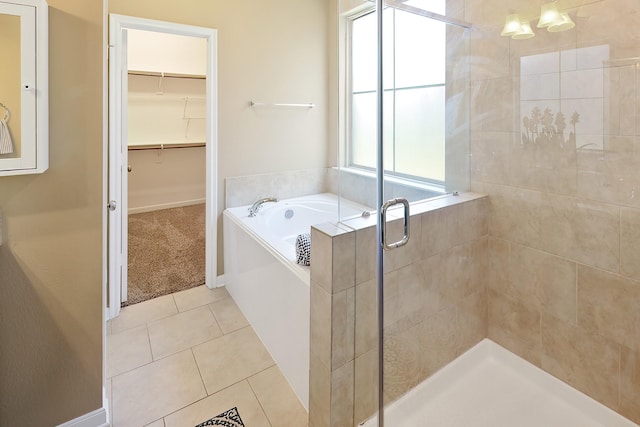 bathroom featuring shower with separate bathtub and tile patterned floors