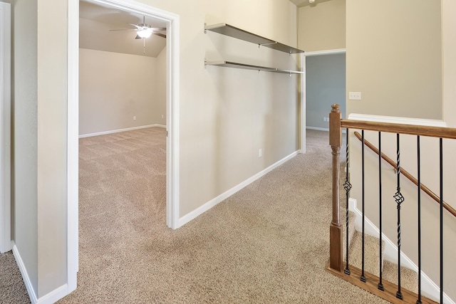 corridor with light colored carpet