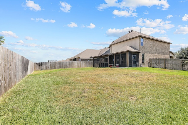 view of yard with a sunroom