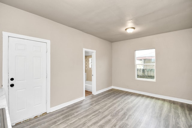 spare room with light hardwood / wood-style floors