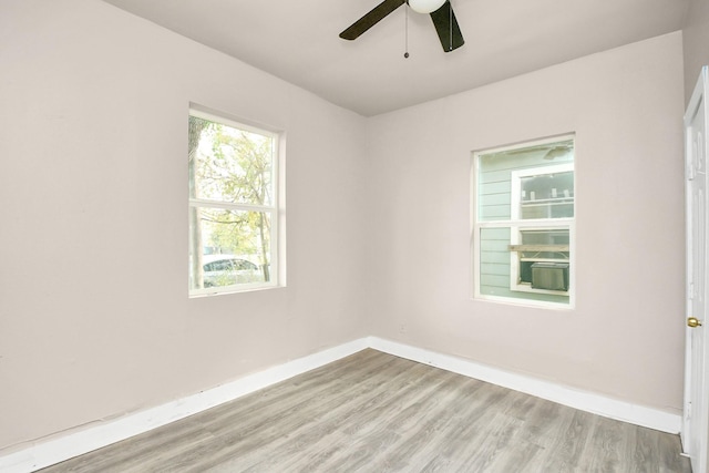 empty room featuring light hardwood / wood-style floors and ceiling fan