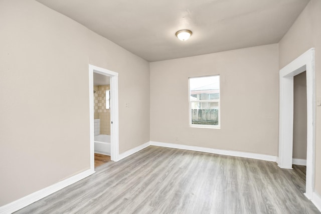 unfurnished room featuring light hardwood / wood-style floors