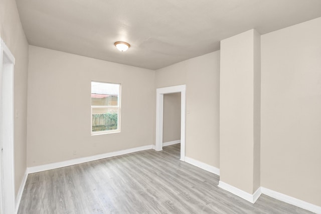 unfurnished room featuring light hardwood / wood-style floors