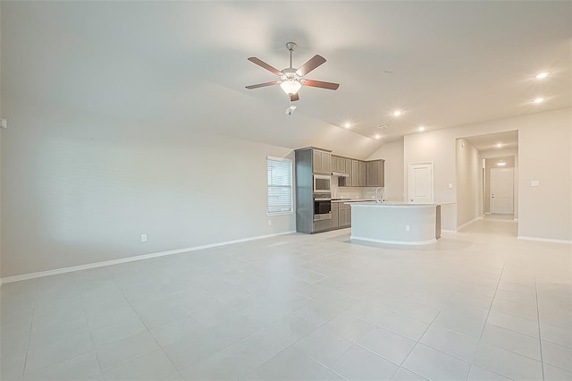 unfurnished living room featuring light tile patterned flooring, ceiling fan, and vaulted ceiling