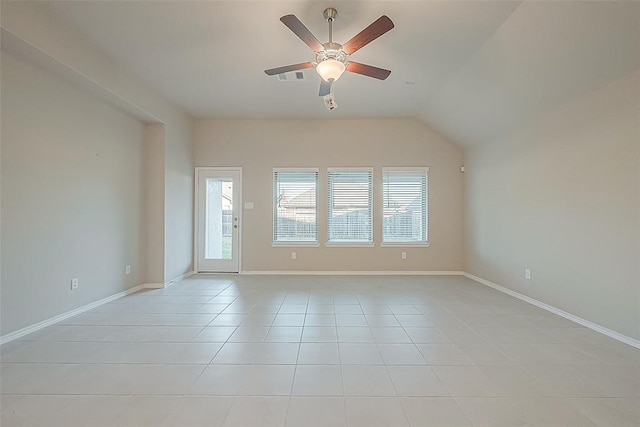 unfurnished room with vaulted ceiling, ceiling fan, and light tile patterned flooring