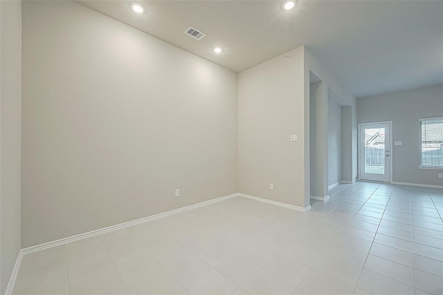 unfurnished room featuring light tile patterned flooring