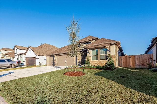 view of front of property with a garage and a front yard