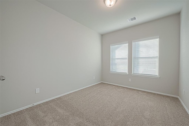 unfurnished room with carpet floors