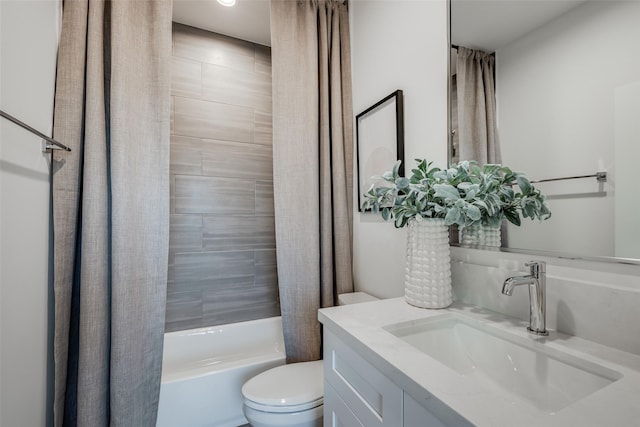 bathroom featuring toilet, vanity, and shower / bath combo