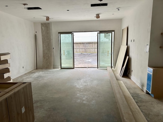 interior space featuring unfinished concrete floors