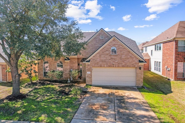 traditional-style house featuring driveway, a shingled roof, a front lawn, and brick siding