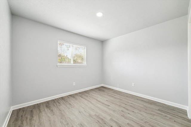 empty room featuring hardwood / wood-style floors