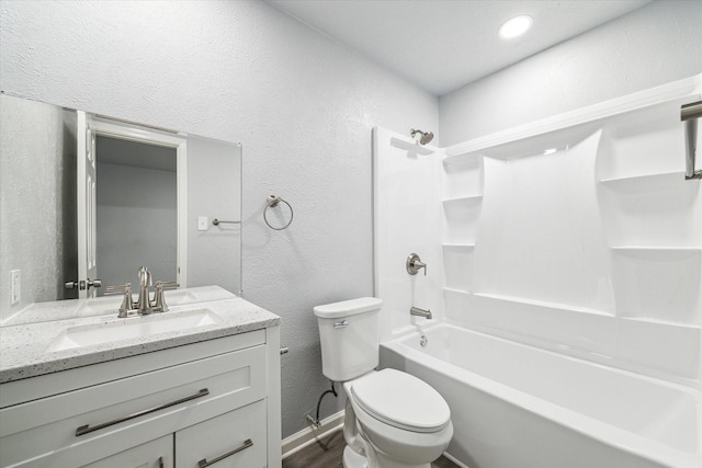 full bathroom with hardwood / wood-style flooring, shower / tub combination, vanity, and toilet