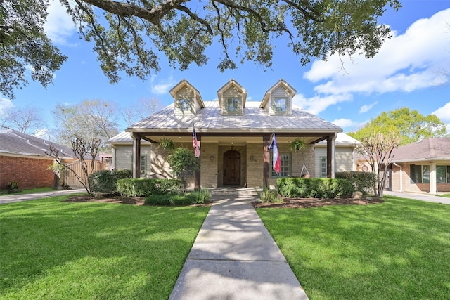 view of front of house with a front yard and covered porch