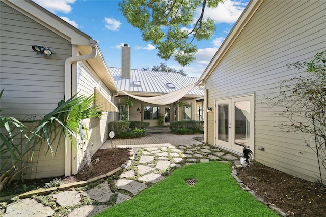 view of yard featuring french doors and a patio area