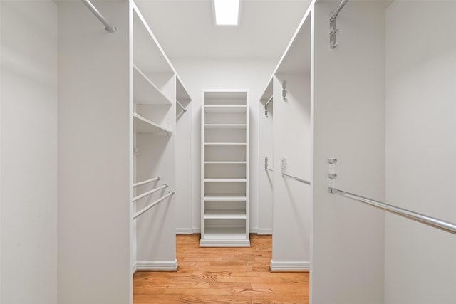 walk in closet featuring hardwood / wood-style floors