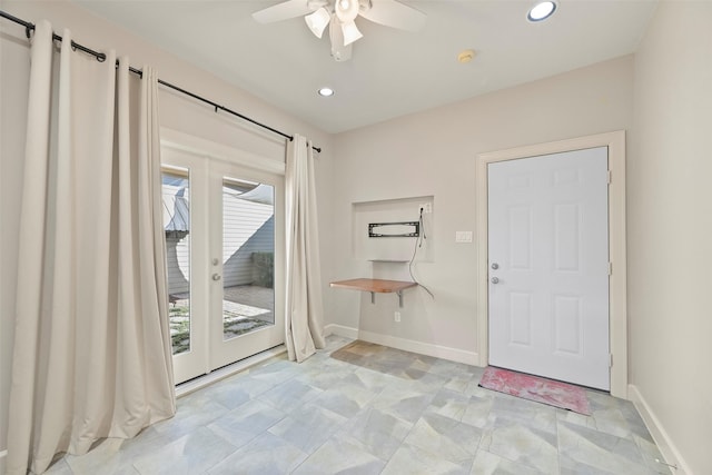 doorway featuring ceiling fan