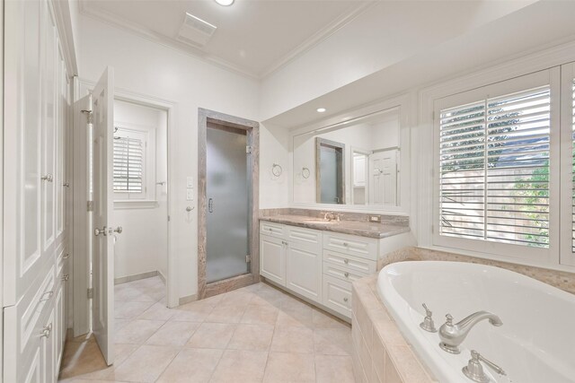 bathroom featuring tile patterned floors, ornamental molding, plus walk in shower, and vanity