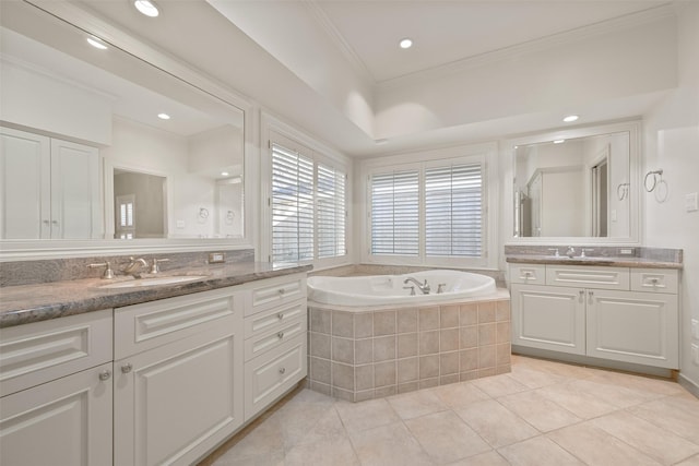 bathroom with vanity, tile patterned flooring, crown molding, and tiled bath