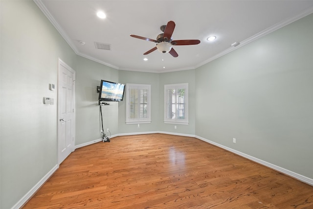 unfurnished room featuring ornamental molding, ceiling fan, and light hardwood / wood-style flooring