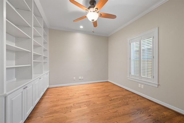 empty room with ceiling fan, ornamental molding, and light hardwood / wood-style floors