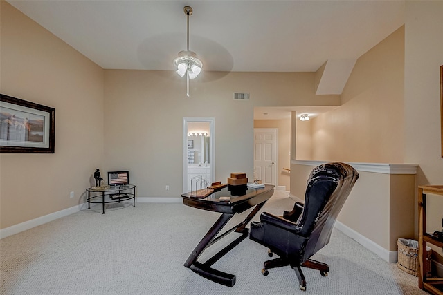 office area featuring light carpet and ceiling fan