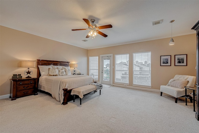 carpeted bedroom with a textured ceiling, crown molding, access to outside, and ceiling fan