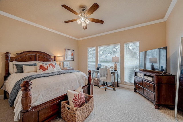 carpeted bedroom with ornamental molding and ceiling fan