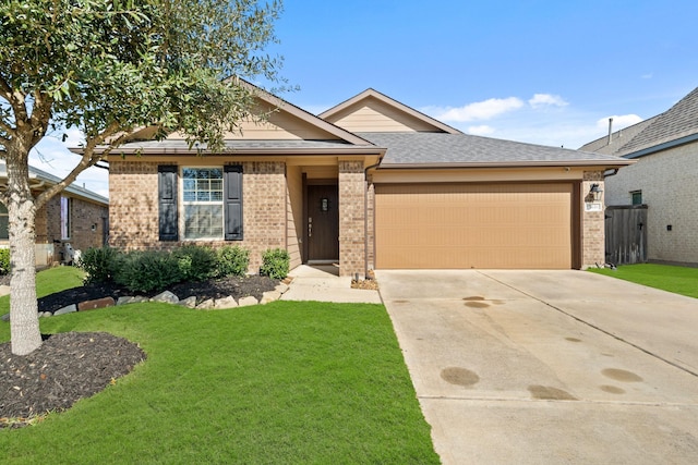 ranch-style home with a garage, brick siding, driveway, and a front lawn