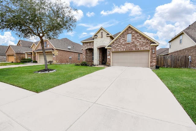 view of front of home featuring a garage and a front lawn