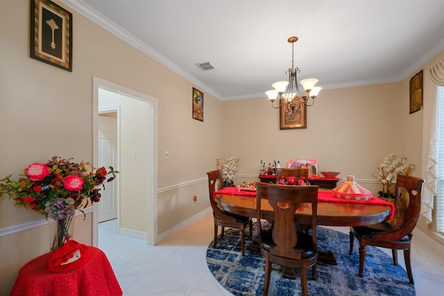 dining space with crown molding, light tile patterned floors, and a chandelier