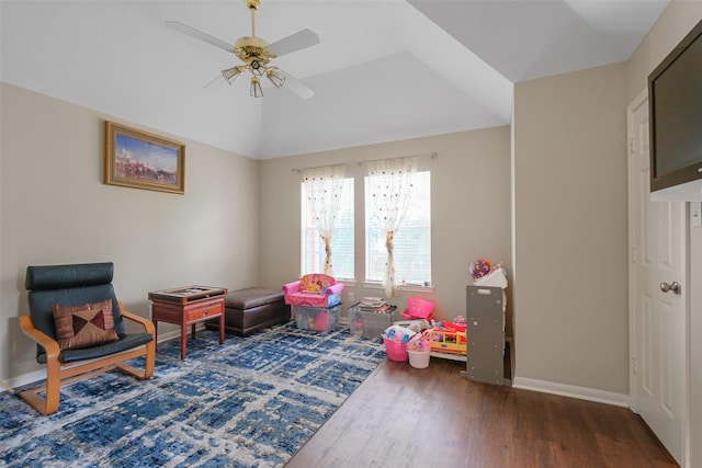 rec room featuring dark hardwood / wood-style flooring, vaulted ceiling, and ceiling fan