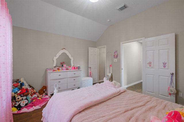 bedroom with lofted ceiling and dark hardwood / wood-style flooring