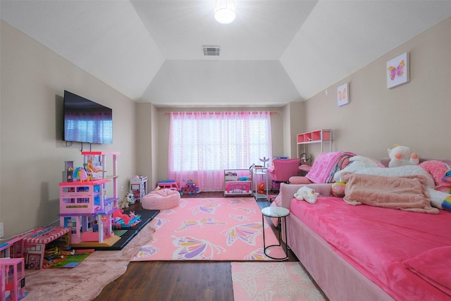 bedroom with hardwood / wood-style flooring and vaulted ceiling