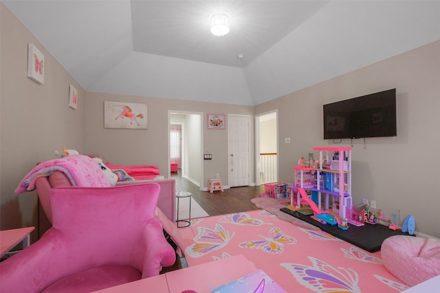 bedroom with hardwood / wood-style flooring and lofted ceiling