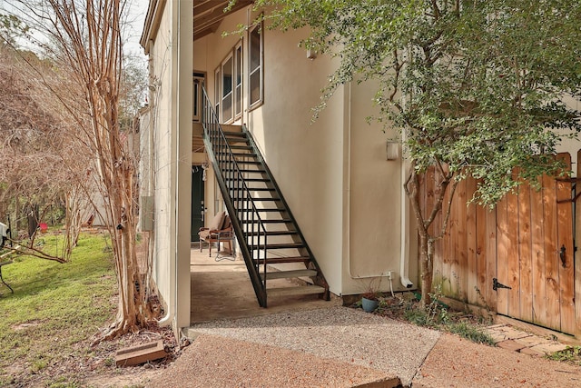 entrance to property featuring a patio